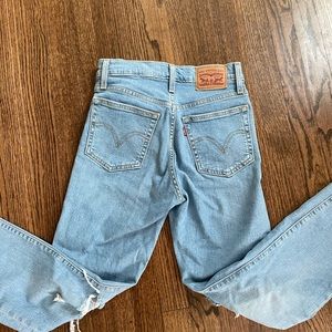 Distressed blue jeans